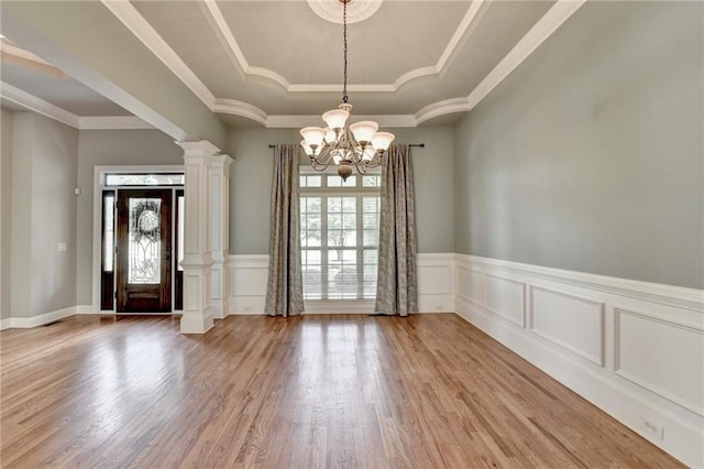 5195 Stefan Ridge Way, Buford, GA 30519 - interior space with a tray ceiling, a wealth of natural light, a chandelier, and wood finished floors