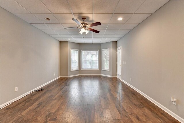 5195 Stefan Ridge Way, Buford, GA 30519 - spare room with a ceiling fan, a drop ceiling, baseboards, and dark wood-type flooring