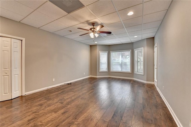 5195 Stefan Ridge Way, Buford, GA 30519 - spare room with a ceiling fan, a drop ceiling, baseboards, and dark wood-type flooring