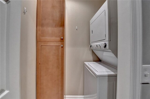 5195 Stefan Ridge Way, Buford, GA 30519 - clothes washing area with laundry area and stacked washer / dryer