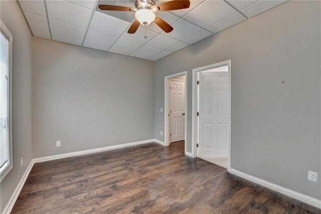 5195 Stefan Ridge Way, Buford, GA 30519 - unfurnished room featuring a drop ceiling, ceiling fan, baseboards, and wood finished floors