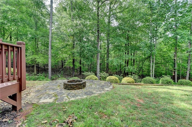 5195 Stefan Ridge Way, Buford, GA 30519 - view of yard with a patio area, a fire pit, a view of trees, and a deck