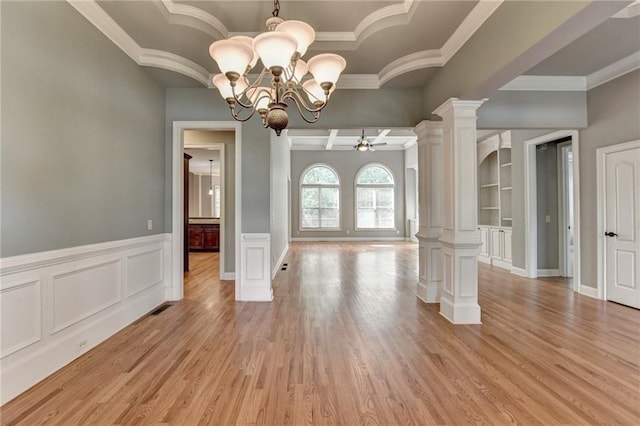 5195 Stefan Ridge Way, Buford, GA 30519 - unfurnished dining area with a wainscoted wall, decorative columns, a notable chandelier, crown molding, and light wood-style floors