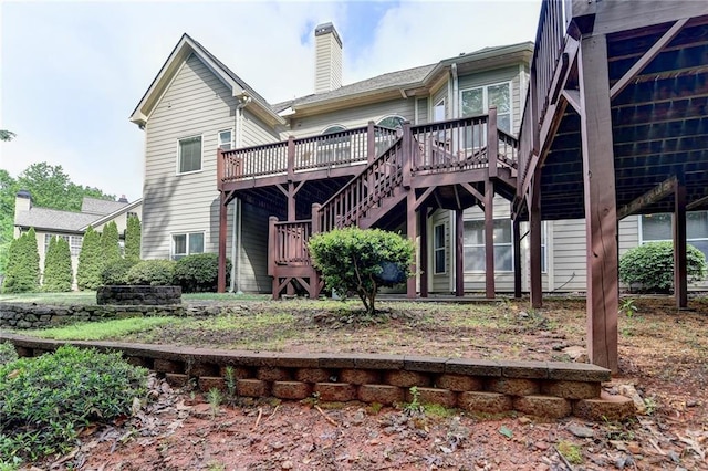5195 Stefan Ridge Way, Buford, GA 30519 - back of house featuring a chimney, stairway, and a deck