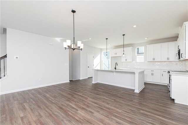 kitchen with white cabinets, a healthy amount of sunlight, and stainless steel appliances