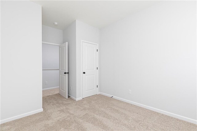 walk in closet with carpet flooring