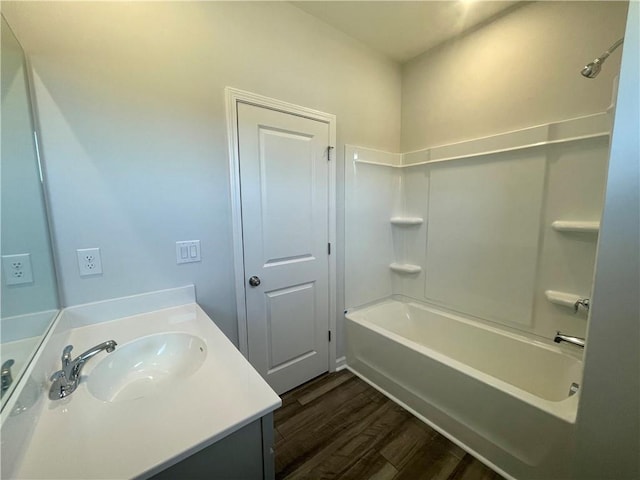 bathroom featuring shower / bathing tub combination, vanity, and wood-type flooring