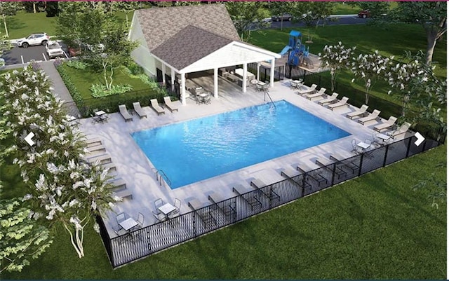 view of pool featuring a yard and a patio