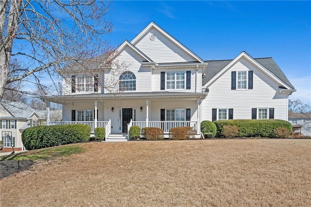 view of front facade featuring a porch and a front yard