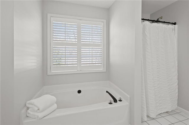 bathroom featuring a bath and tile patterned floors