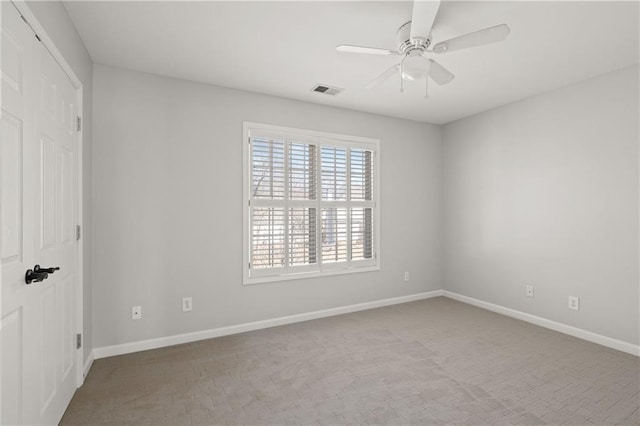 unfurnished bedroom with carpet floors, visible vents, baseboards, and a ceiling fan