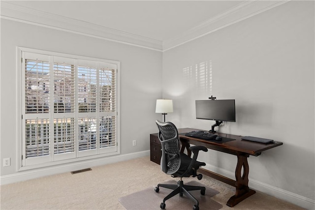 carpeted office space featuring baseboards, visible vents, and crown molding