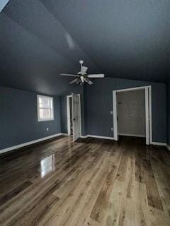 bonus room with ceiling fan, wood-type flooring, a textured ceiling, and vaulted ceiling