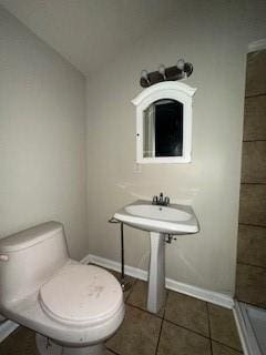 bathroom featuring tile patterned floors and toilet