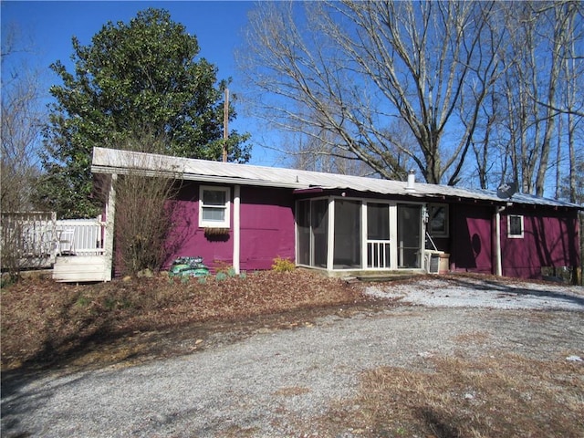 view of front facade featuring a sunroom