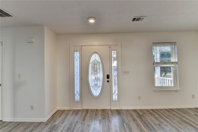 foyer with light hardwood / wood-style floors