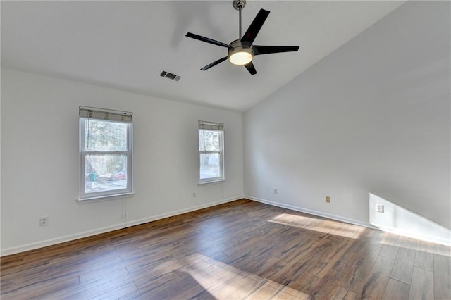 unfurnished room featuring ceiling fan, dark hardwood / wood-style flooring, and vaulted ceiling