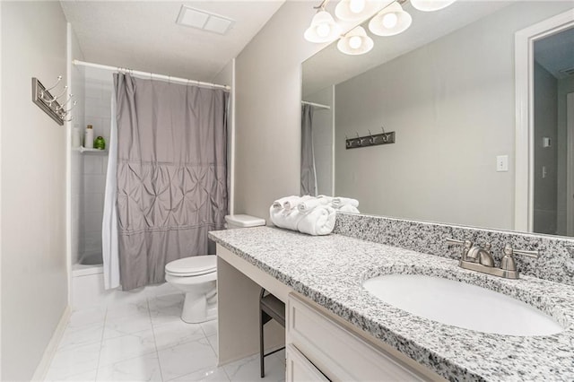 bathroom featuring marble finish flooring, toilet, vanity, and curtained shower