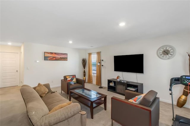 living area featuring baseboards, recessed lighting, and light colored carpet