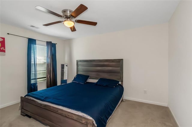 bedroom featuring ceiling fan, visible vents, baseboards, and carpet floors