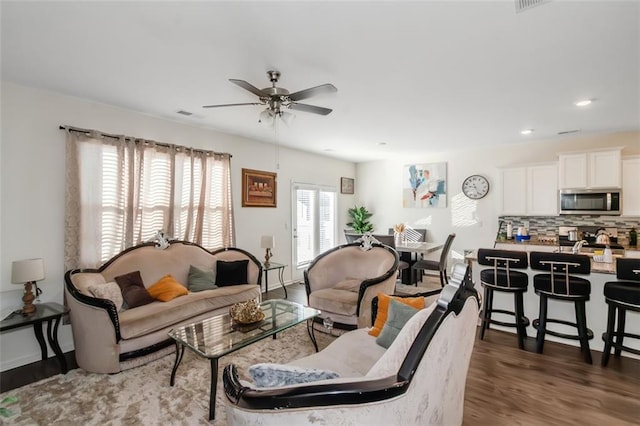 living room with recessed lighting, baseboards, wood finished floors, and ceiling fan