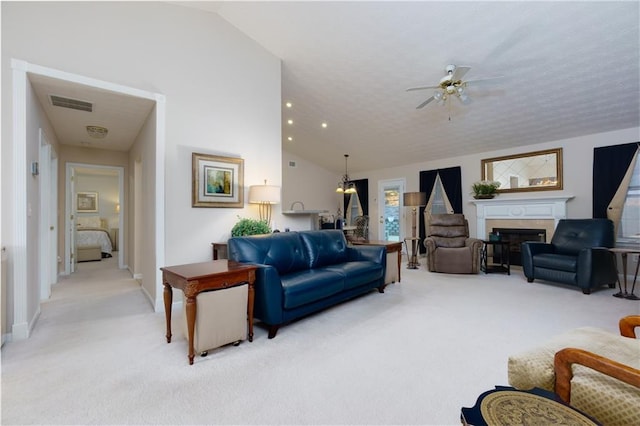 living room with visible vents, light colored carpet, a fireplace, and vaulted ceiling