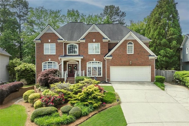 6317 Benbrooke Overlook NW, Acworth, GA 30101 - colonial house with brick siding, driveway, and a garage