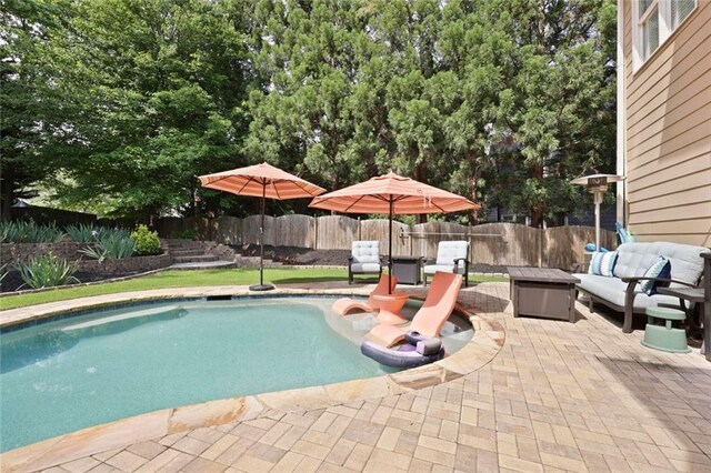 6317 Benbrooke Overlook NW, Acworth, GA 30101 - view of pool featuring a patio, a fenced backyard, and an outdoor living space with a fire pit