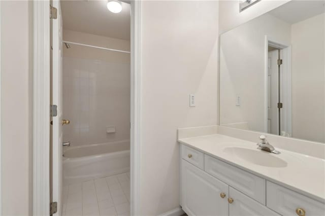 bathroom featuring vanity, tile patterned flooring, and shower / washtub combination