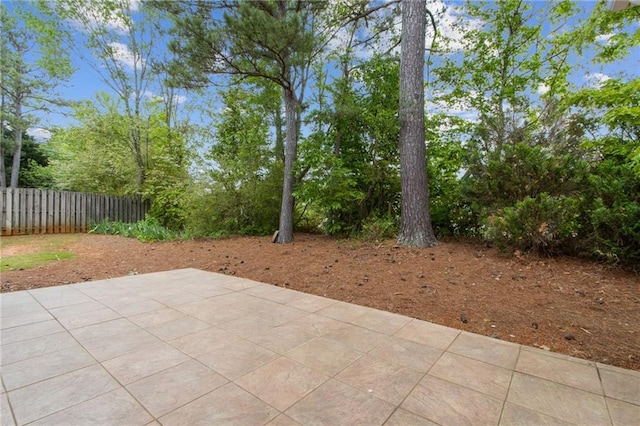 view of patio / terrace featuring fence