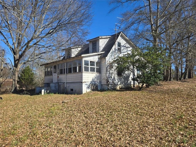 view of home's exterior featuring a sunroom