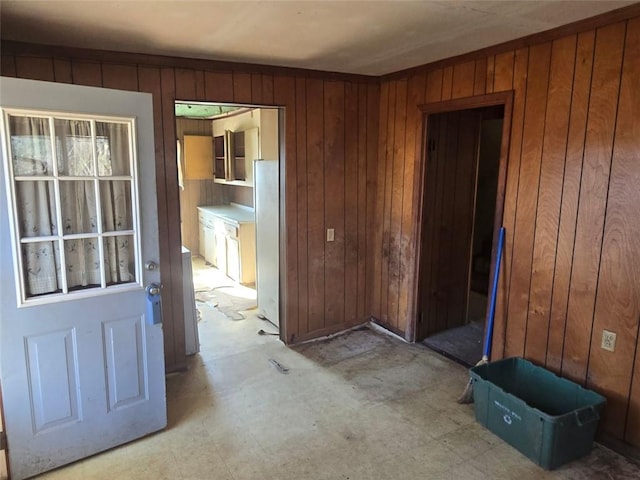 interior space featuring wood walls