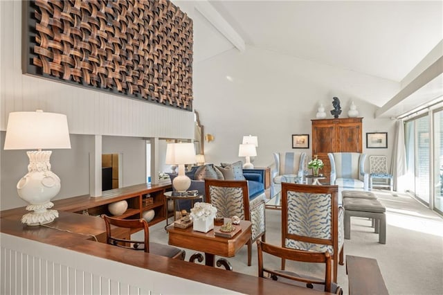 living room featuring carpet floors, high vaulted ceiling, and beam ceiling