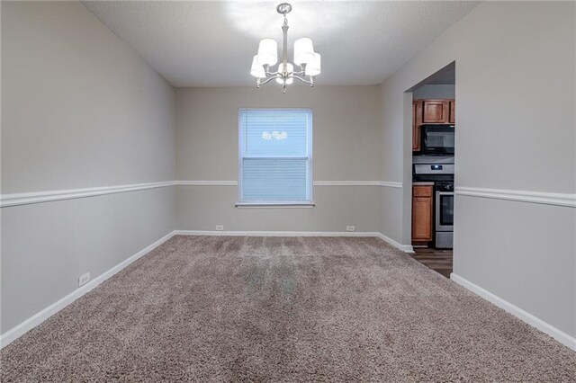 unfurnished dining area featuring a chandelier and dark carpet