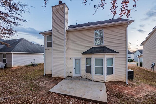 rear view of property featuring a patio