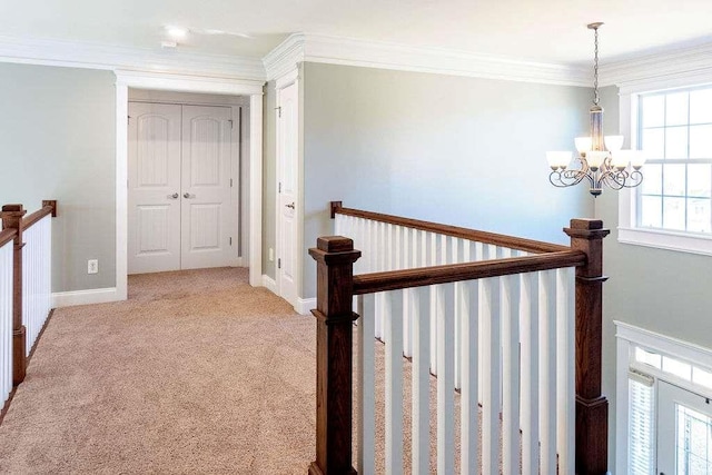 109 Lighthorse Blvd, Mcdonough, GA 30252 - hall with an upstairs landing, a chandelier, carpet floors, and crown molding