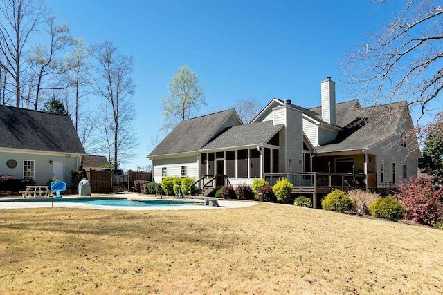 109 Lighthorse Blvd, Mcdonough, GA 30252 - rear view of property featuring a sunroom, a chimney, and a wooden deck