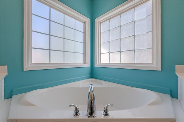 bathroom featuring a bath and vanity