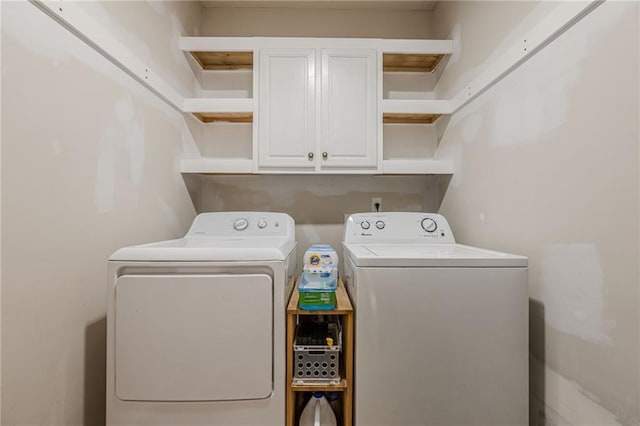 laundry room featuring cabinet space and washer and dryer