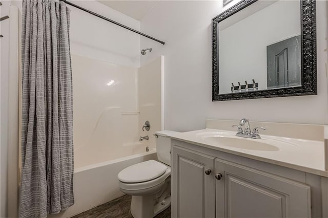 bathroom featuring vanity, shower / bath combo with shower curtain, and toilet