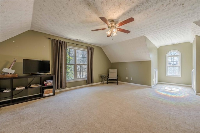 bonus room with lofted ceiling, carpet floors, a textured ceiling, and baseboards