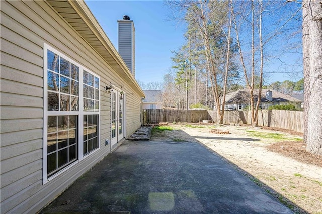 exterior space with a patio and a fenced backyard