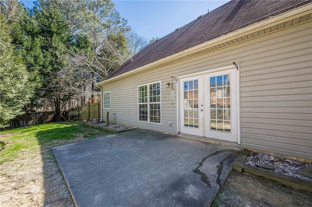 exterior space with french doors, a yard, a patio, and fence