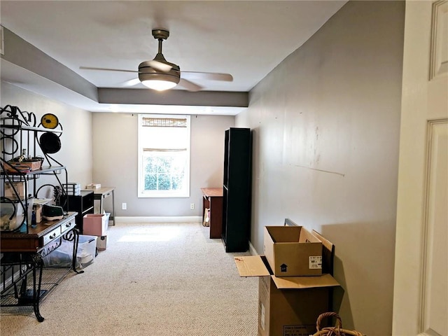 living area featuring ceiling fan, light colored carpet, and baseboards