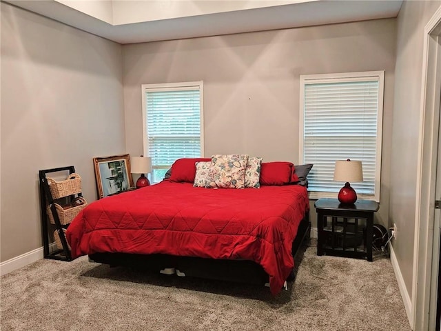 bedroom with carpet flooring and baseboards