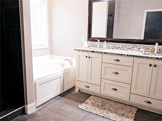 full bathroom with a garden tub, double vanity, and tiled shower