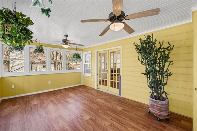 unfurnished sunroom with french doors and wooden ceiling