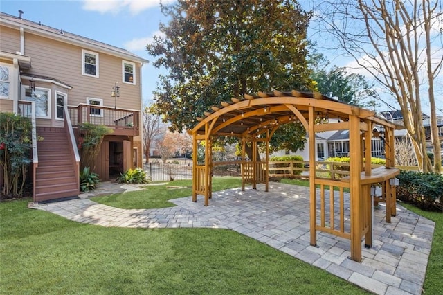 view of yard with stairs, a patio, fence, and a pergola