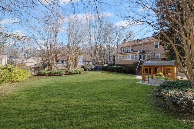 view of yard featuring a patio and fence