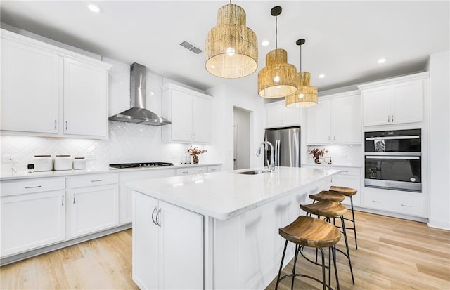 112 Jane Blvd NW, Cartersville, GA 30120 - kitchen with wall chimney exhaust hood, a sink, stainless steel appliances, backsplash, and a kitchen bar